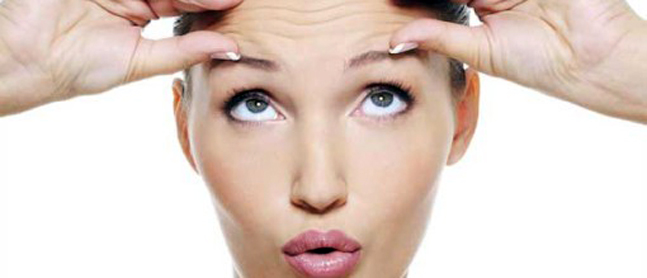 female face with wrinkles on her forehead